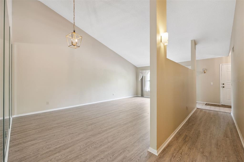 2192 Swedish Drive, Unit 26 Clearwater, FL 33763 - Photo 8 of 49 a view of a hallway with wooden floor