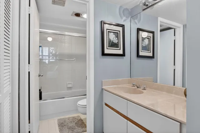 a view of a lake with boats and trees in the background