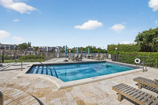 an aerial view of residential houses with outdoor space and seating