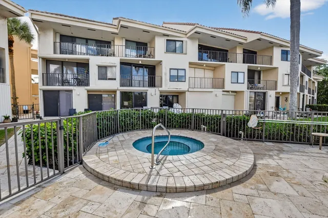 an aerial view of a houses and a yard