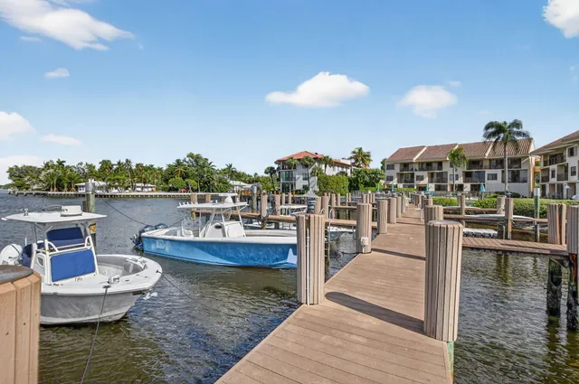 an aerial view of houses with yard