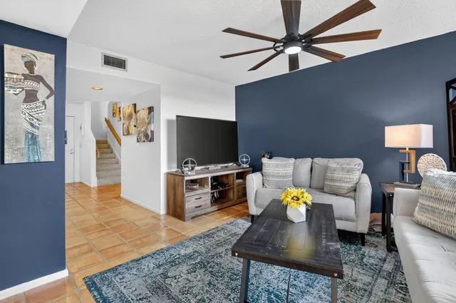 a kitchen with a sink window and cabinets