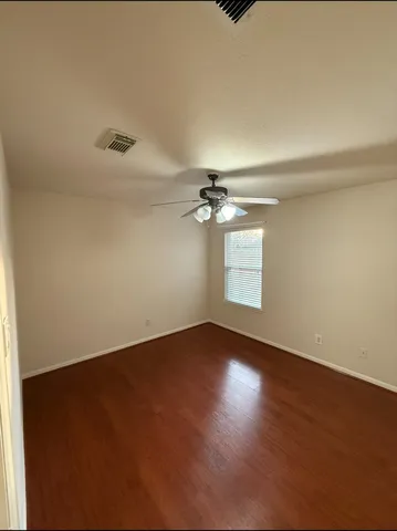 an empty room with a empty space and windows