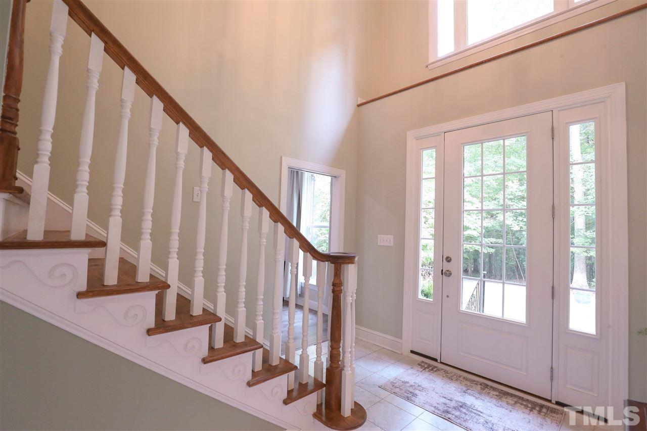 8925 Ball Road Bahama, NC 27503 - Photo 2 of 28 a view of entryway with wooden floor and stairs