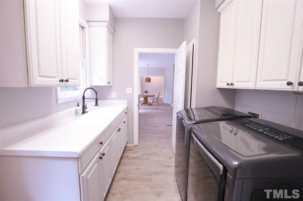 8925 Ball Road Bahama, NC 27503 - Photo 11 of 28 a kitchen with a sink stove and cabinets