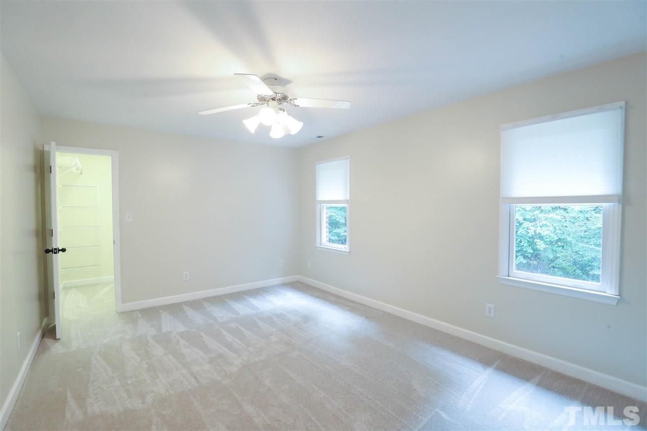 8925 Ball Road Bahama, NC 27503 - Photo 20 of 28 an empty room with windows and fan