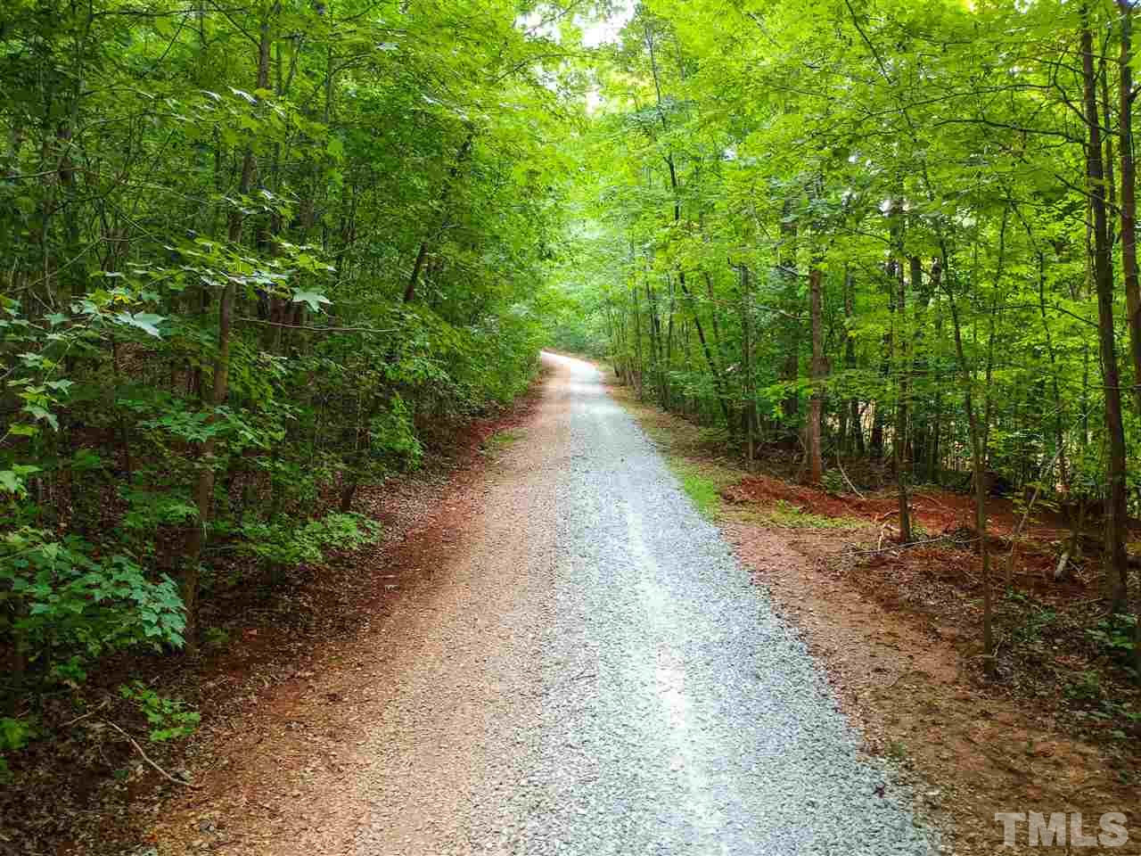 8925 Ball Road Bahama, NC 27503 - Photo 25 of 28 a view of a pathway with a yard