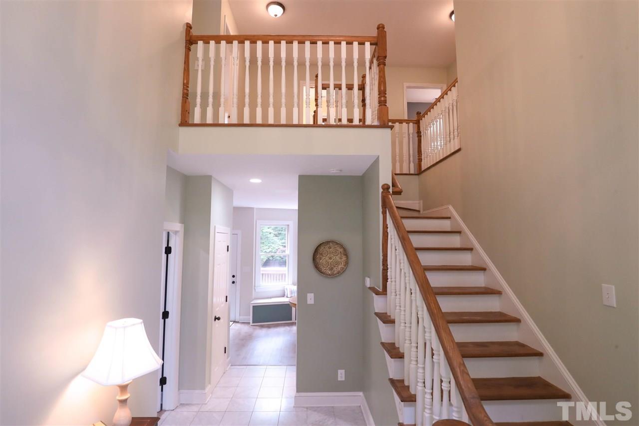 8925 Ball Road Bahama, NC 27503 - Photo 4 of 28 a view of entryway and hall with wooden floor
