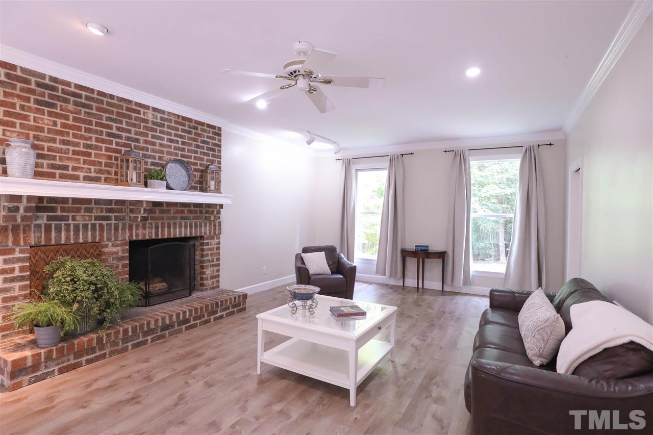 8925 Ball Road Bahama, NC 27503 - Photo 5 of 28 a living room with furniture and a fireplace