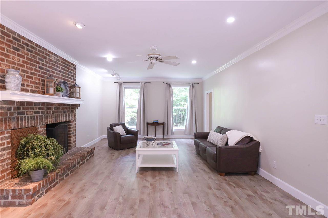 8925 Ball Road Bahama, NC 27503 - Photo 6 of 28 a living room with furniture and a fireplace