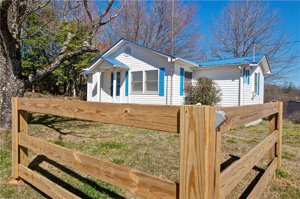 2165 Townsend Mill Road Young Harris, GA 30582 - Photo 1 of 32 a front view of a house with a yard
