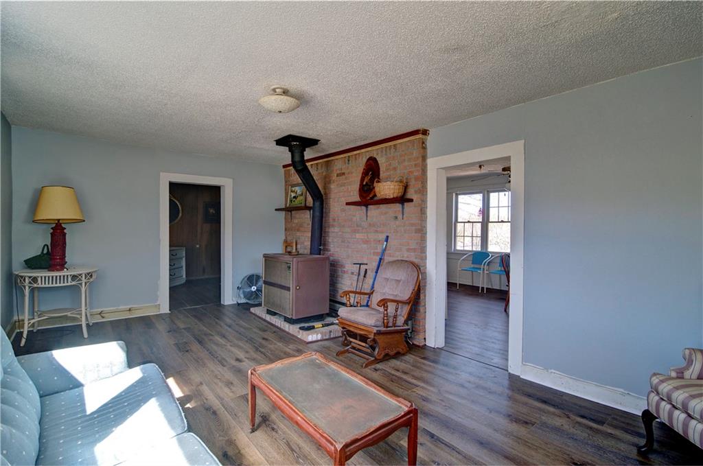 2165 Townsend Mill Road Young Harris, GA 30582 - Photo 11 of 32 a living room with furniture a rug and a wooden floor