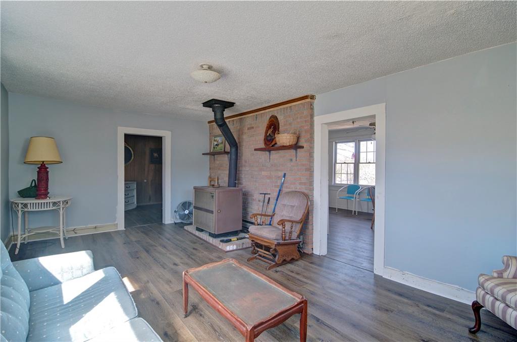 2165 Townsend Mill Road Young Harris, GA 30582 - Photo 12 of 32 a living room with furniture and a wooden floor