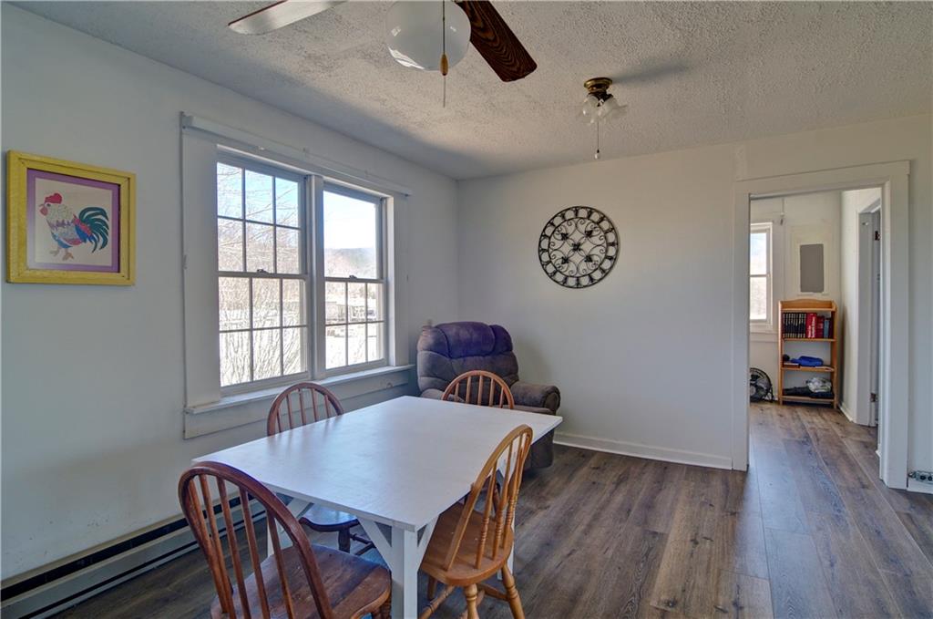 2165 Townsend Mill Road Young Harris, GA 30582 - Photo 16 of 32 a view of a dining room with furniture window and wooden floor