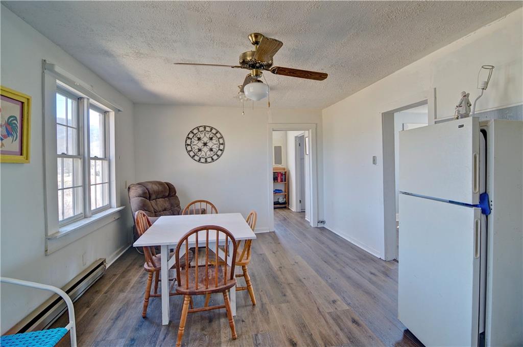 2165 Townsend Mill Road Young Harris, GA 30582 - Photo 17 of 32 a view of a dining room with furniture window and wooden floor