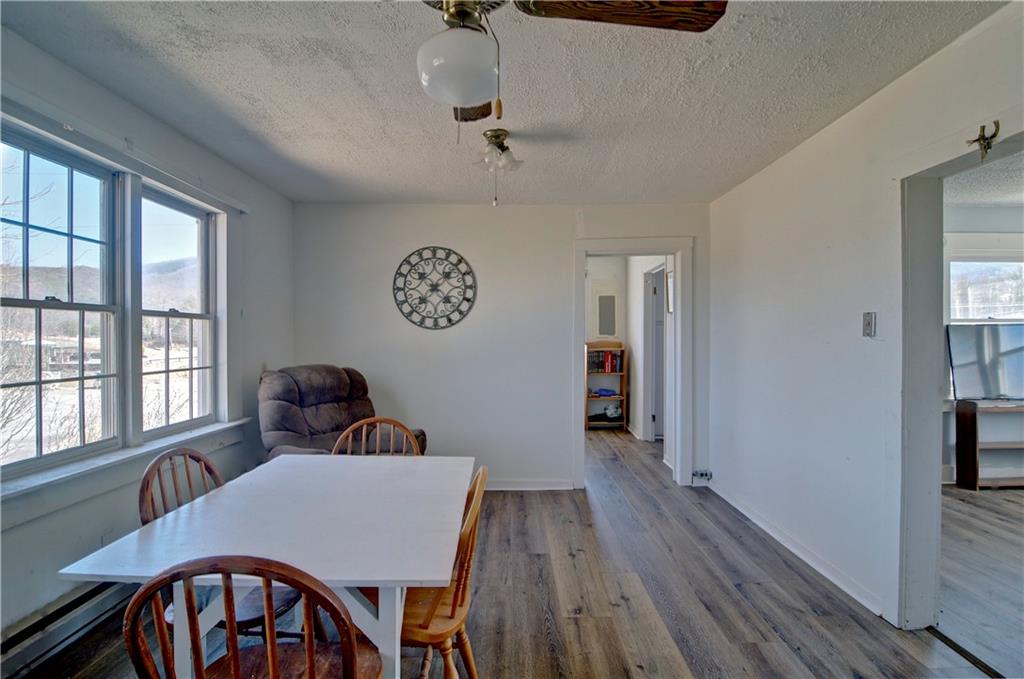 2165 Townsend Mill Road Young Harris, GA 30582 - Photo 21 of 32 a view of a dining room with furniture window and wooden floor
