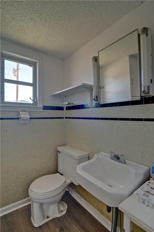 2165 Townsend Mill Road Young Harris, GA 30582 - Photo 27 of 32 a bathroom with a toilet a sink and mirror