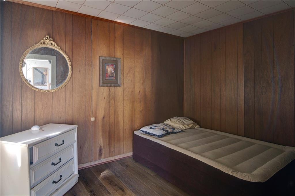 2165 Townsend Mill Road Young Harris, GA 30582 - Photo 28 of 32 a room with a bed and a mirror