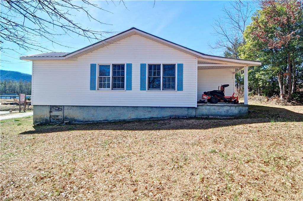 2165 Townsend Mill Road Young Harris, GA 30582 - Photo 4 of 32 a front view of a house with a yard