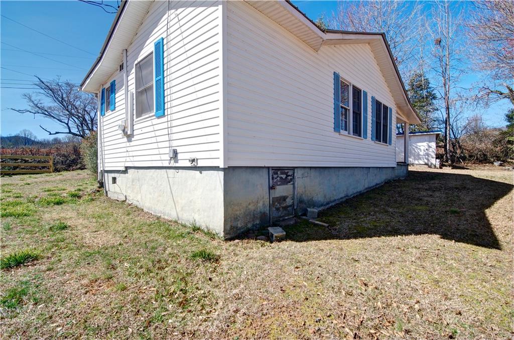 2165 Townsend Mill Road Young Harris, GA 30582 - Photo 5 of 32 a front view of a house with a yard