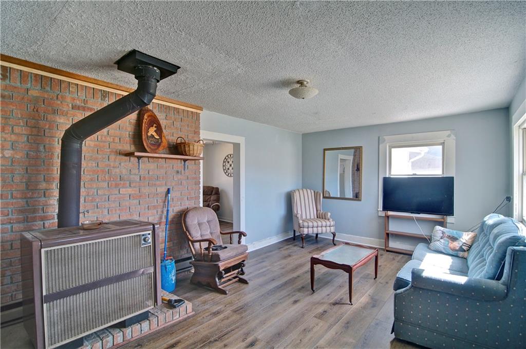 2165 Townsend Mill Road Young Harris, GA 30582 - Photo 6 of 32 a living room with furniture and a flat screen tv