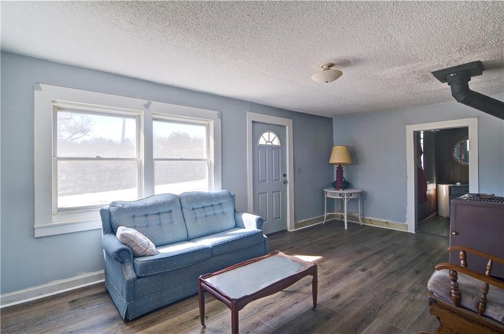 2165 Townsend Mill Road Young Harris, GA 30582 - Photo 10 of 32 a living room with furniture a window and a wooden floor
