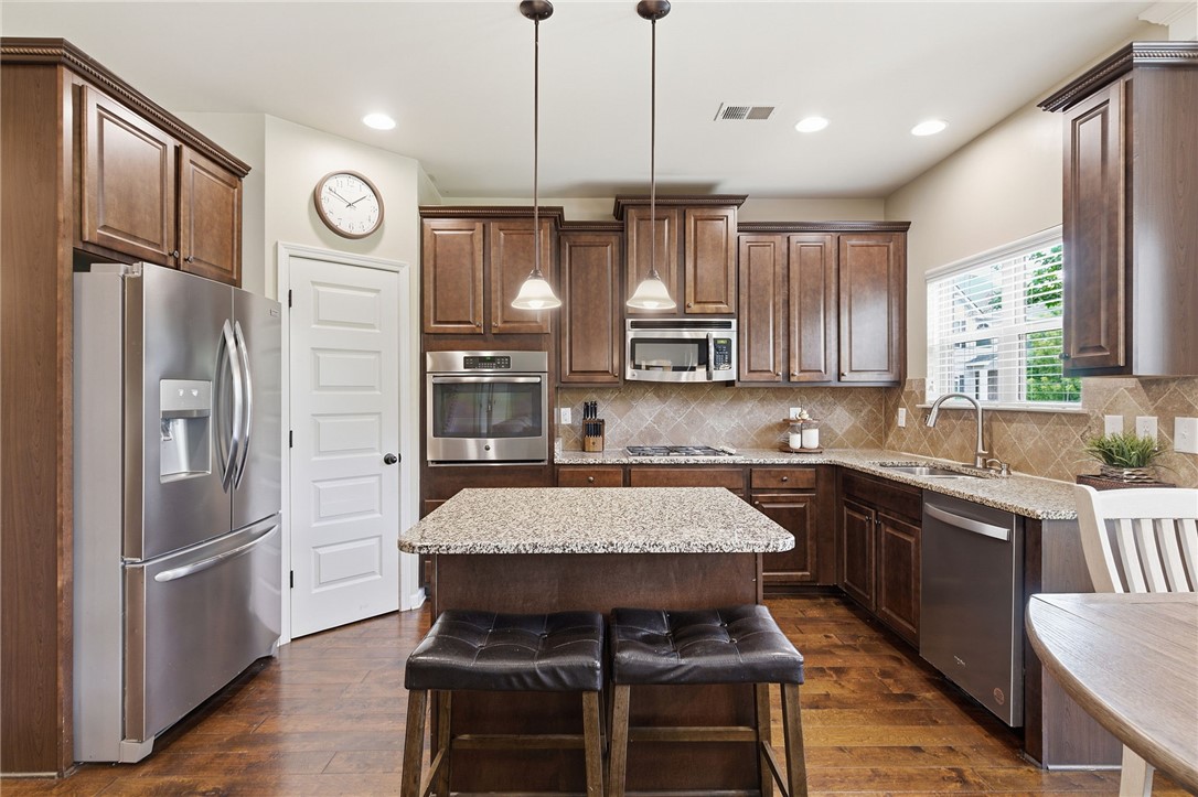138 Buckland Drive Anderson, SC 29621 - Photo 13 of 49 This spacious kitchen offers ample cabinet storage, a functional island, and stainless steel appliances.