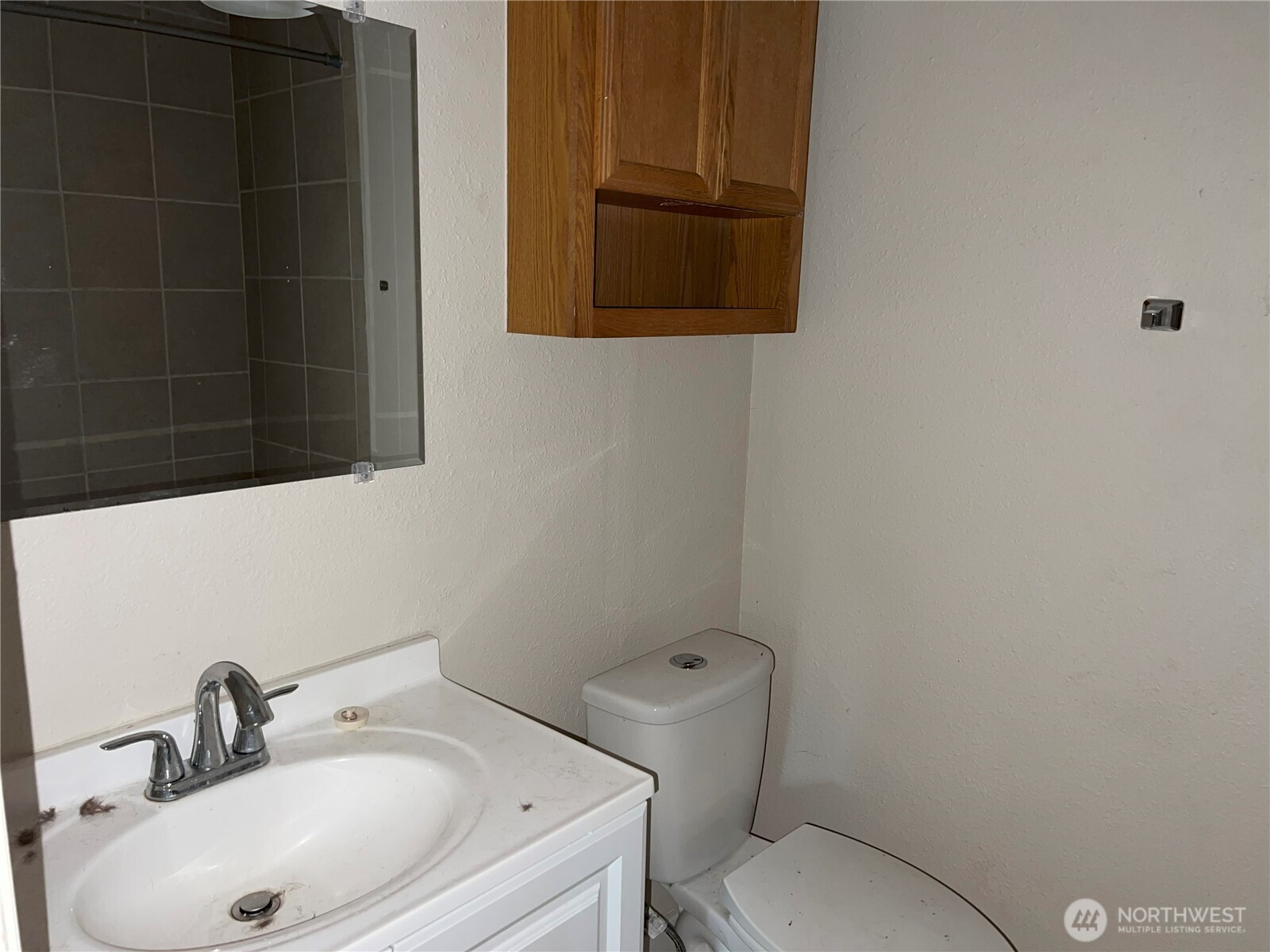 511 190th Street East Spanaway, WA 98387 - Photo 17 of 33 a bathroom with a sink toilet and mirror