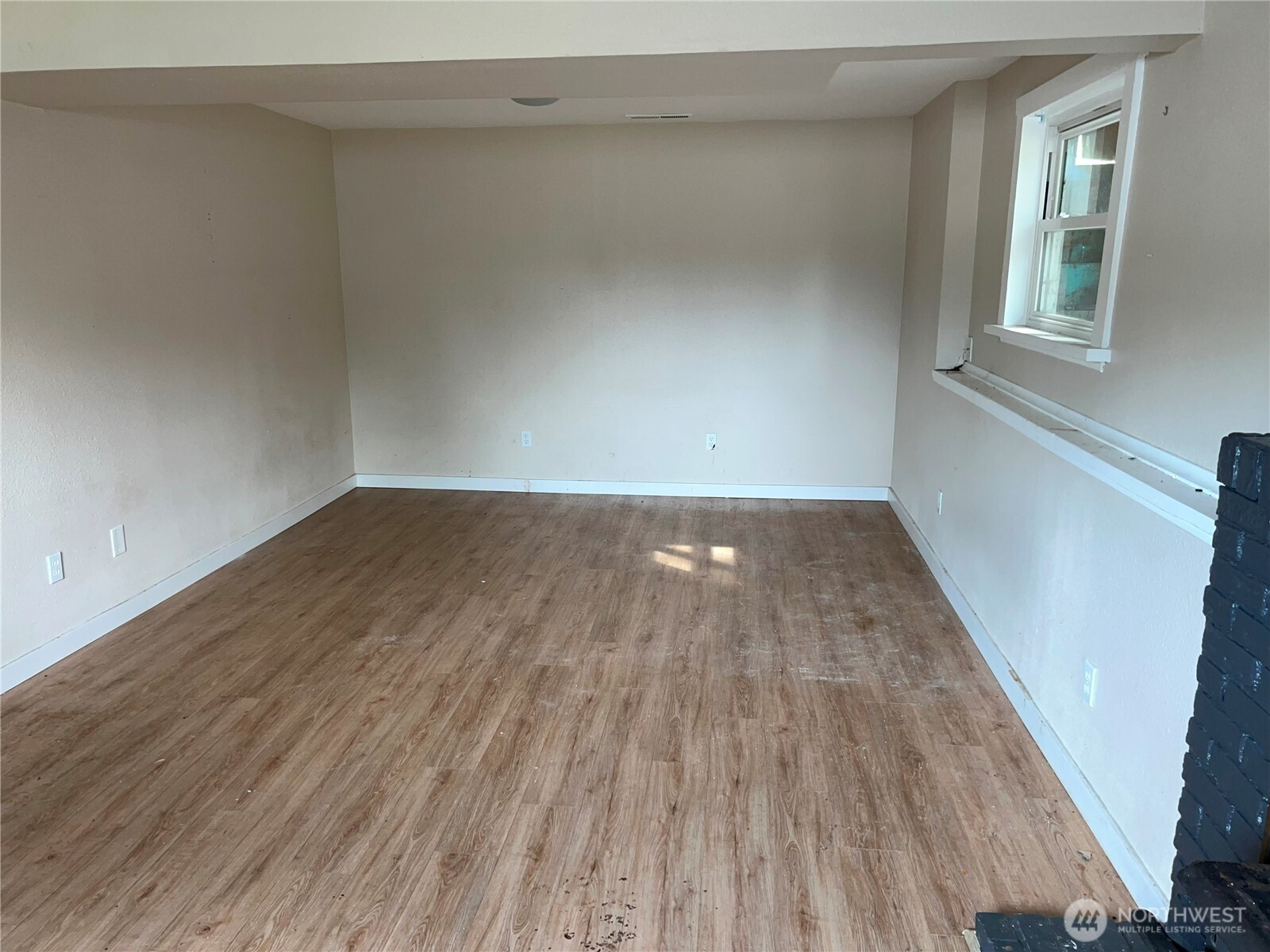 511 190th Street East Spanaway, WA 98387 - Photo 22 of 33 a view of a room with wooden floor and windows