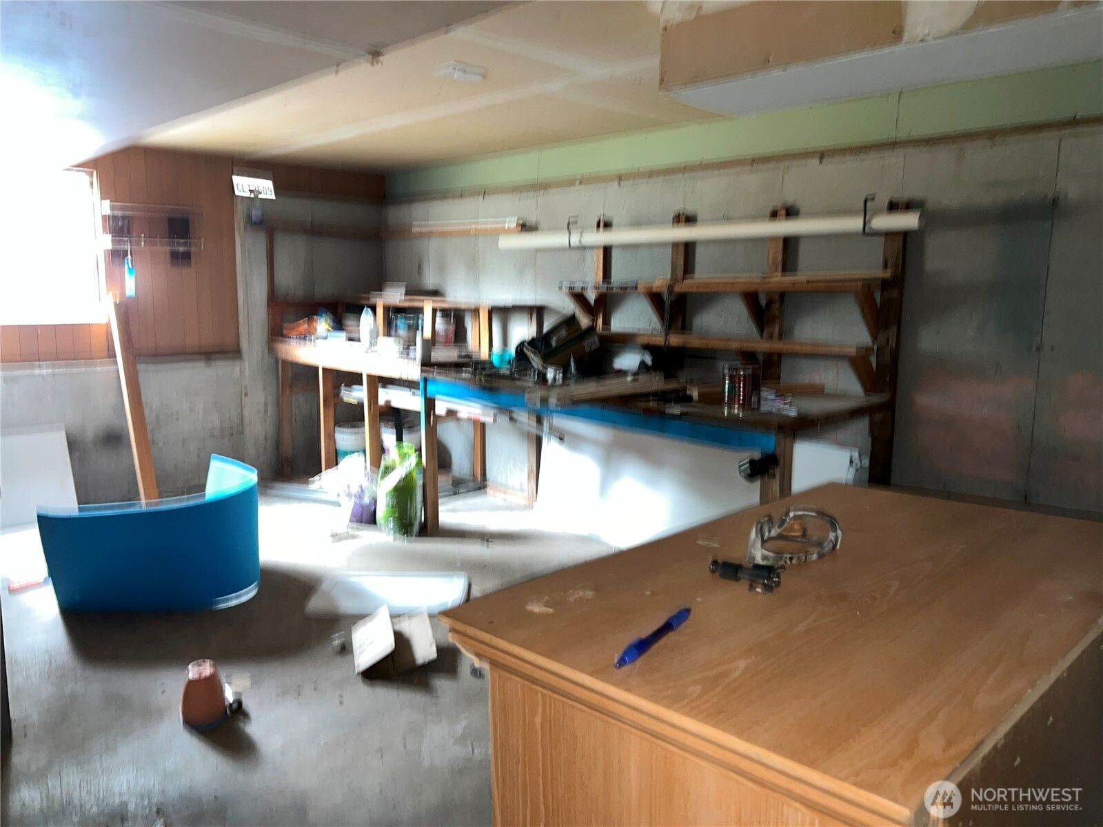 511 190th Street East Spanaway, WA 98387 - Photo 31 of 33 a room with lots of furniture and clutter