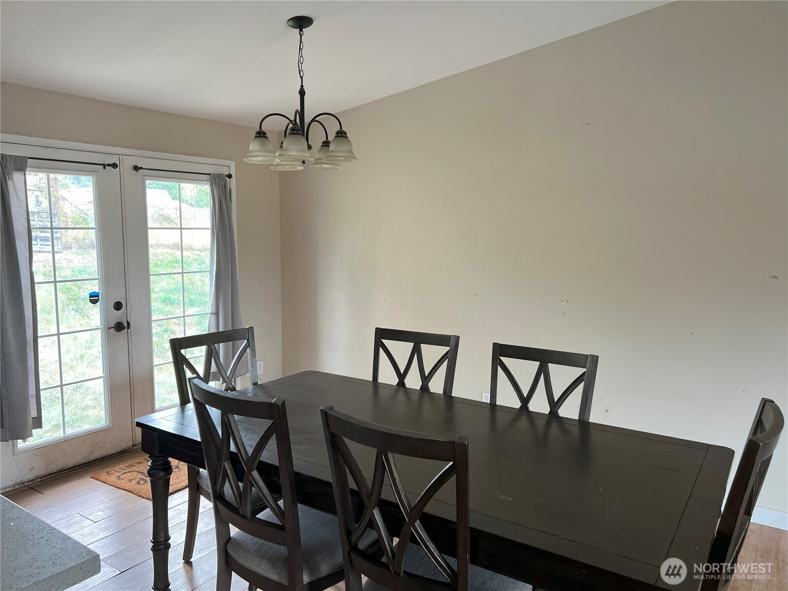 511 190th Street East Spanaway, WA 98387 - Photo 10 of 33 a view of a dining room with furniture window and wooden floor