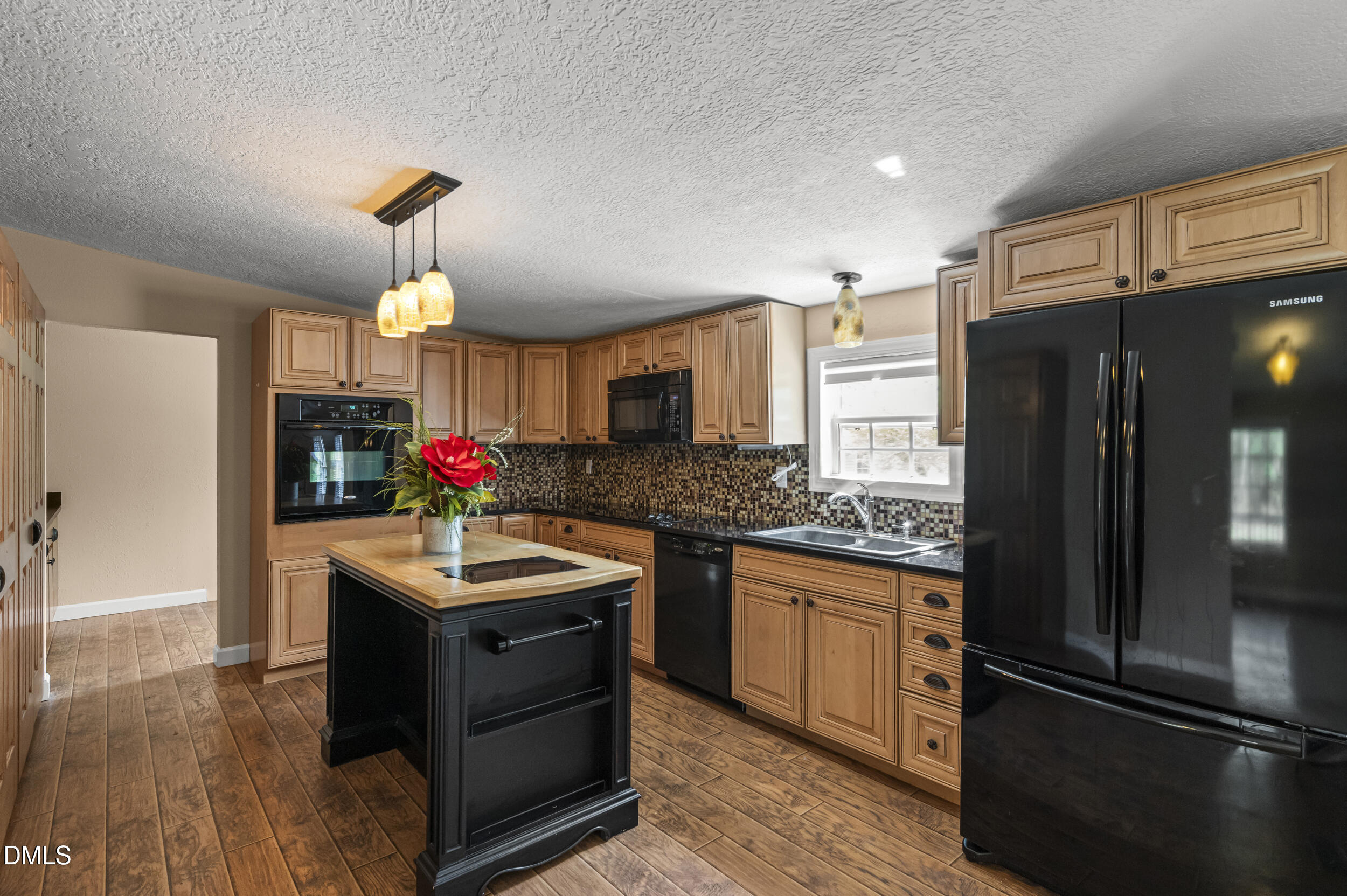 221 Pinkney Church Road Fremont, NC 27830 - Photo 6 of 36 a kitchen with granite countertop a refrigerator and a sink