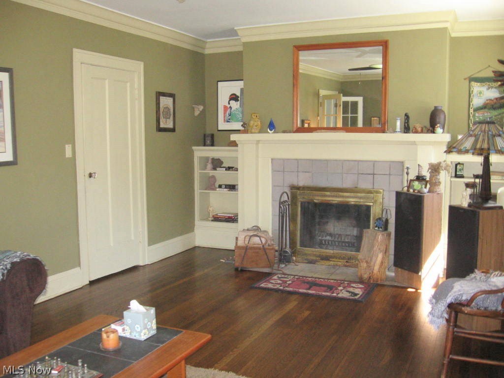 2587 Exeter Road Cleveland, OH 44118 - Photo 3 of 15 Living room with fireplace and refinished hardwood floors