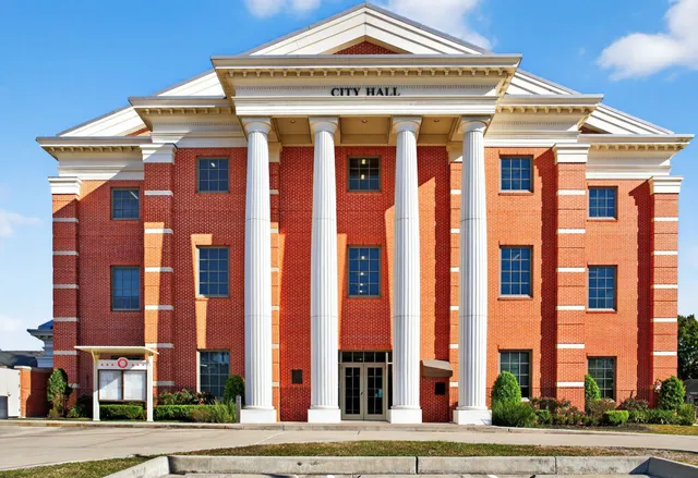 an aerial view of a house with a lake view