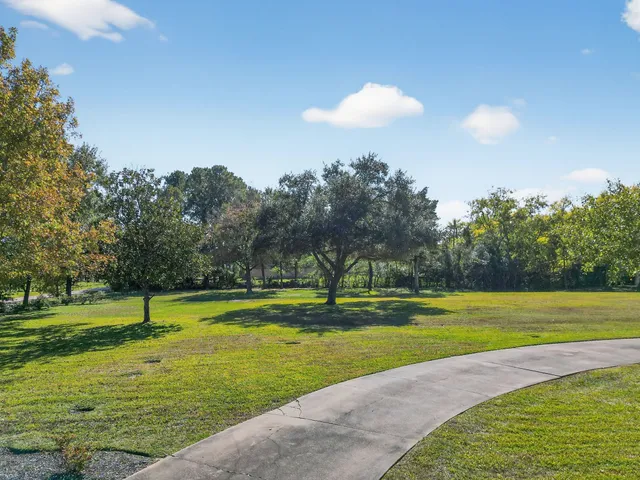 a view of a swimming pool with an outdoor space and seating area
