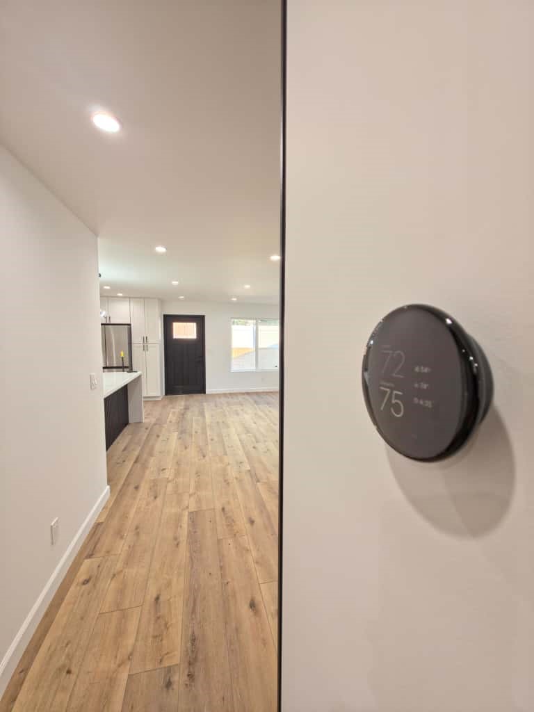 7045 Nestle Avenue Reseda, CA 91335 - Photo 12 of 15 wooden floor in a hall with a large window