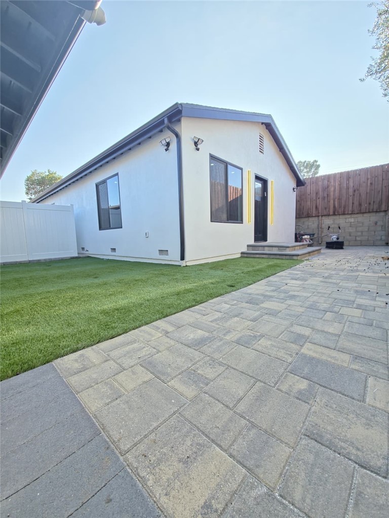7045 Nestle Avenue Reseda, CA 91335 - Photo 15 of 15 a front view of a house with a yard