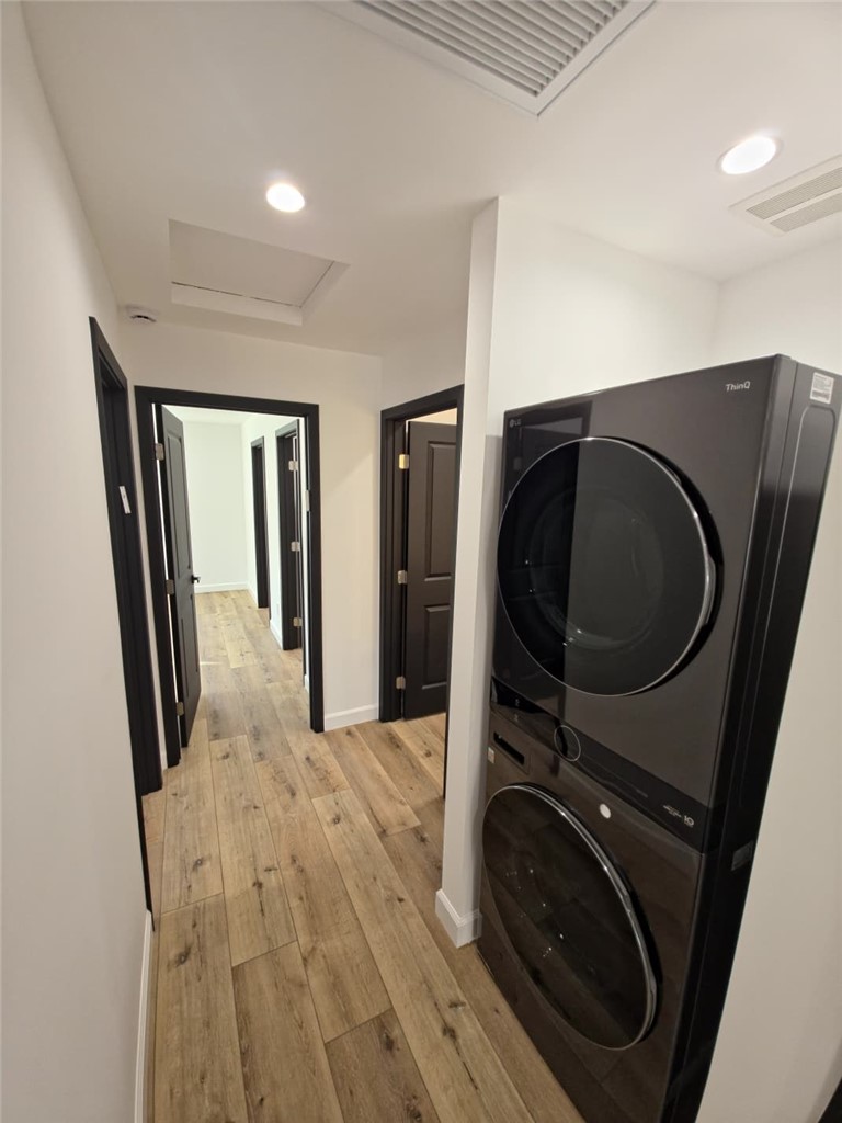 7045 Nestle Avenue Reseda, CA 91335 - Photo 9 of 15 a view of a storage and utility room with washer and dryer