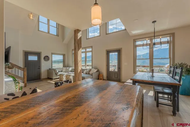 a view of a livingroom with furniture window and wooden floor