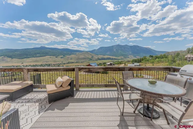 a view of a balcony with furniture