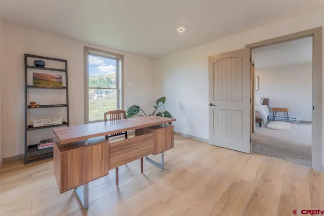a view of a room with furniture window and wooden floor