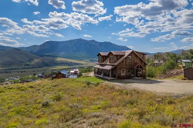 a view of a chair and table in the small yard