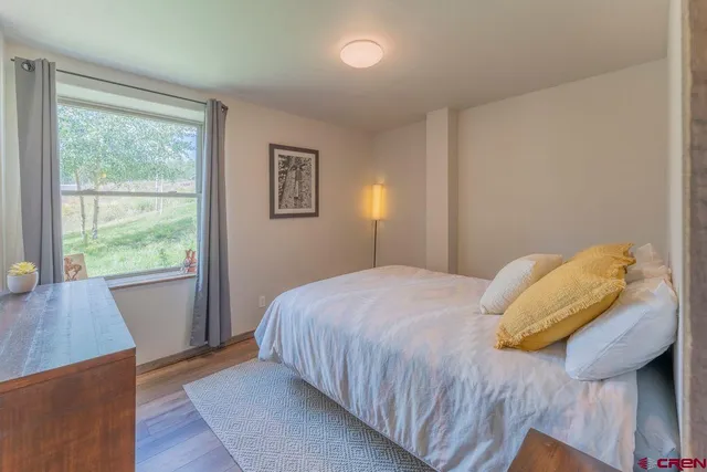 a bedroom with two beds and a couch