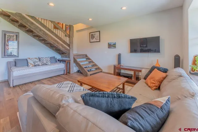a view of a livingroom with furniture and wooden floor