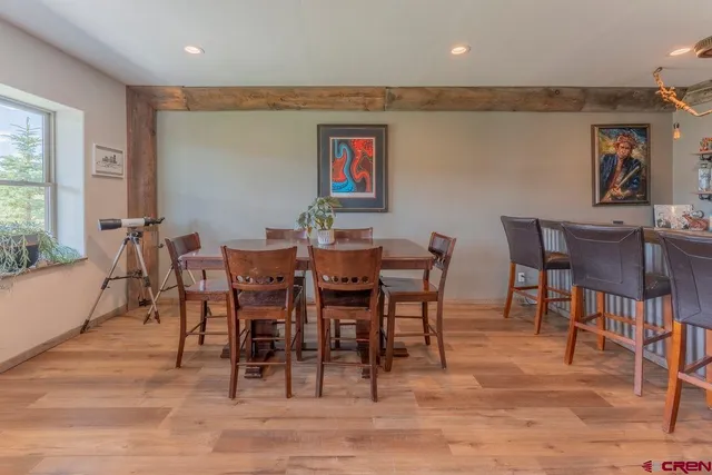 a dining room with furniture and window