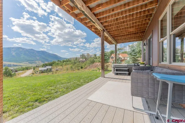 a view of a big yard with lots of green space