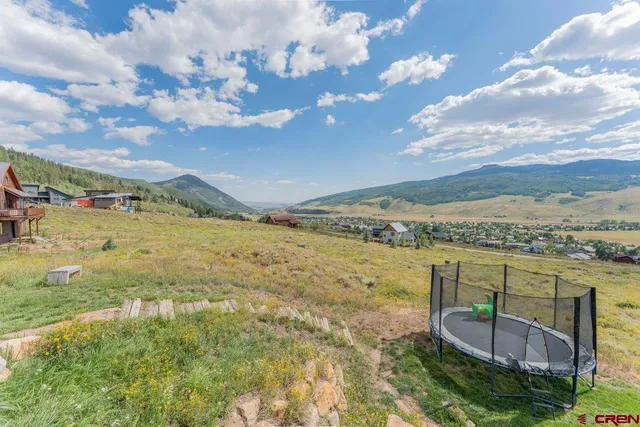 a view of an ocean with a mountain