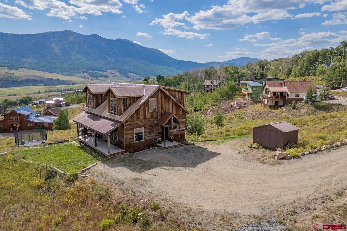 334 Anderson Drive Crested Butte, CO 81224 - Photo 44 of 45 a view of a house with a yard from a terrace
