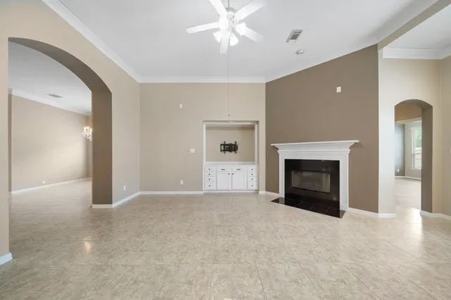 a view of empty room with a fireplace
