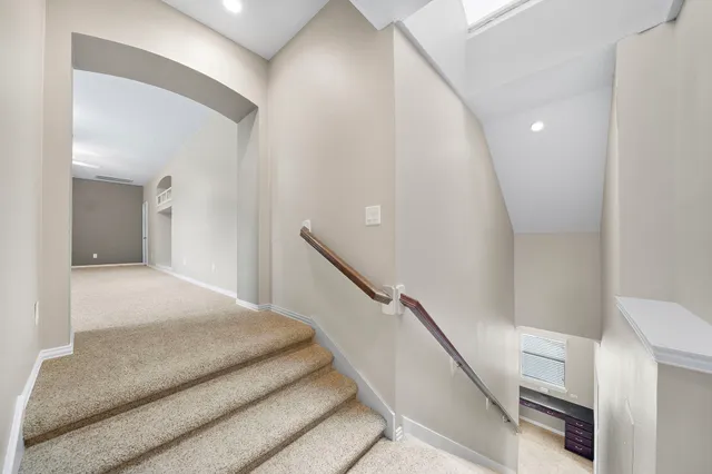 a bedroom with a bed and a hallway